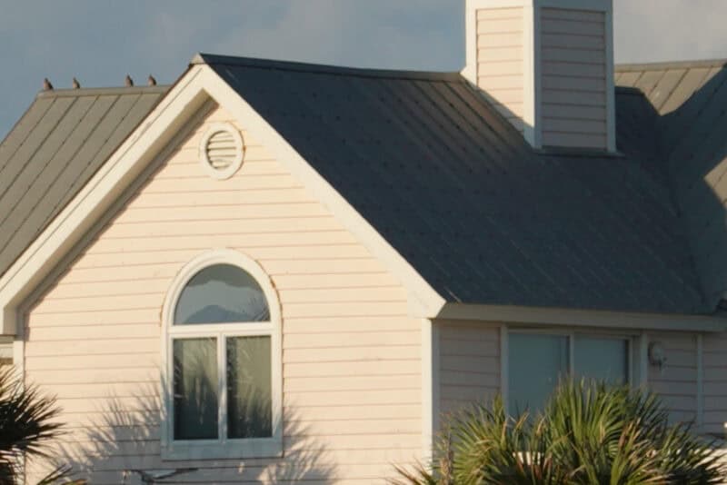 Close crop of a house's gabled roof and arched window using Digital Zoom
