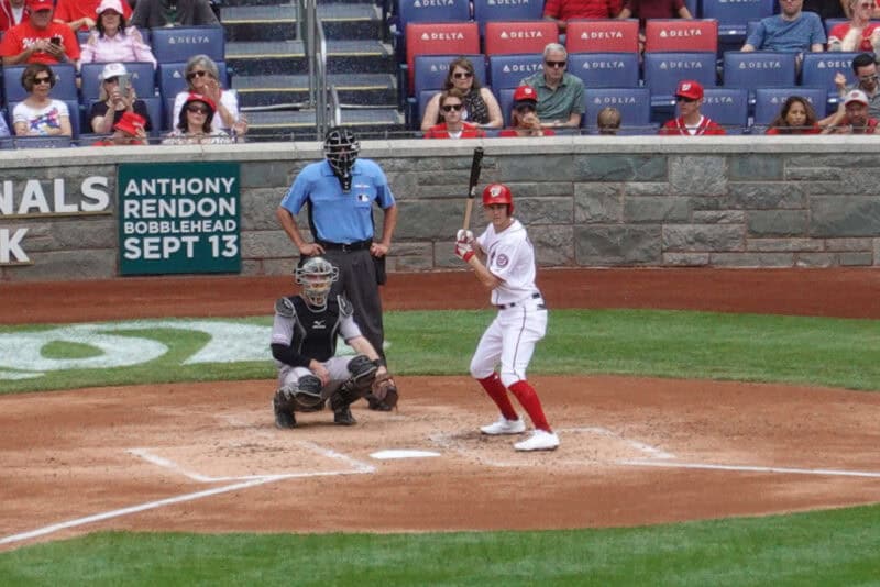 Close view of a batter, catcher and umpire at home plate using Digital Zoom
