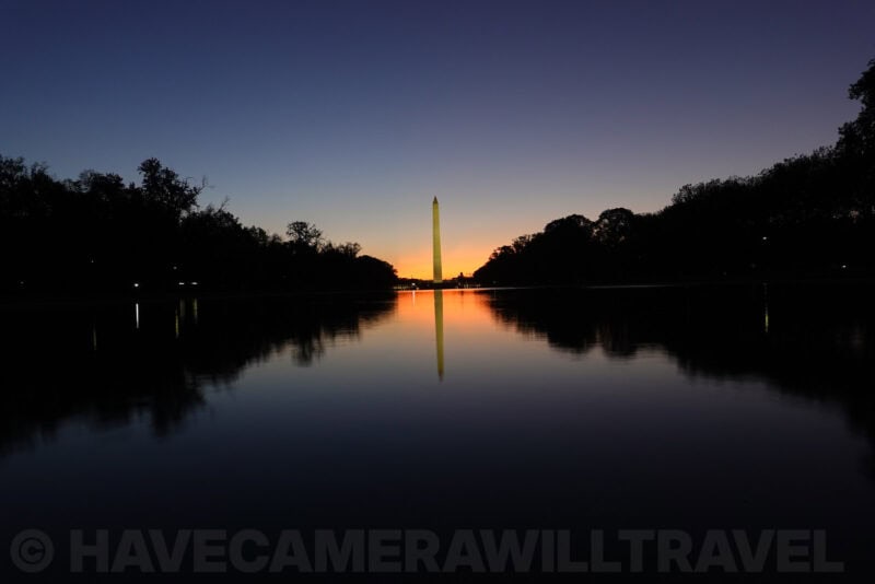 Washington Monument and tree line reflected in calm water at sunrise, ISO 125 test shot