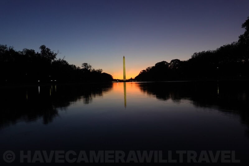 Washington Monument framed by silhouetted trees at sunrise, ISO 200 sample photo