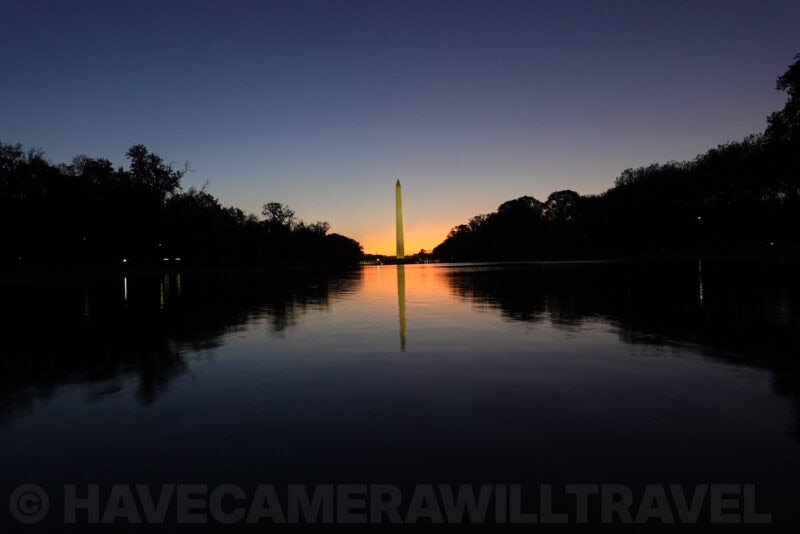Washington Monument silhouette with orange sunrise glow over the pool, ISO 320 test image