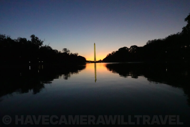 Washington Monument silhouette over a rippled reflecting pool with grainy shadows, ISO 6400 sample