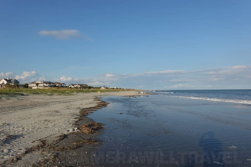 Wide beach scene with shoreline houses and calm tide pool shot at 24mm