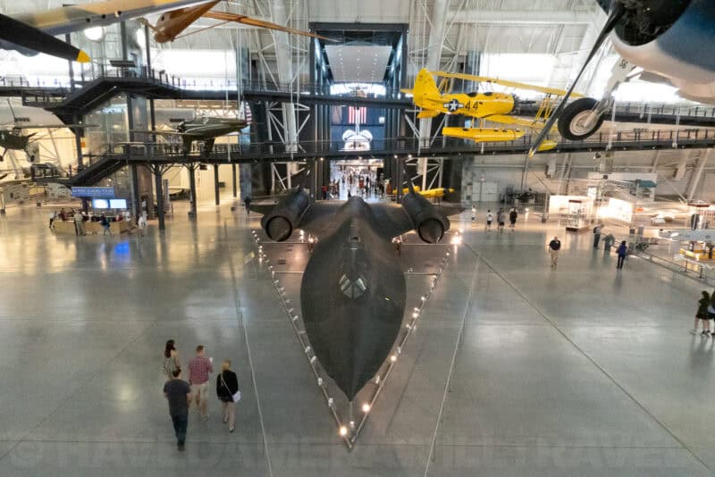 Elevated view of the SR-71 Blackbird surrounded by vintage aircraft in the Udvar-Hazy hangar