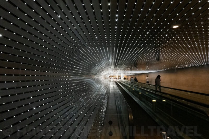 Glittering tunnel of lights above a moving walkway at the National Gallery of Art East Building