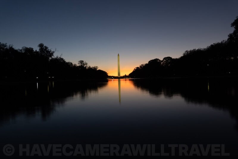 Washington Monument reflected in the still Lincoln Memorial Reflecting Pool at dawn
