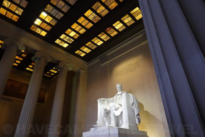 Lincoln Memorial statue and coffered ceiling viewed at an angle inside the chamber