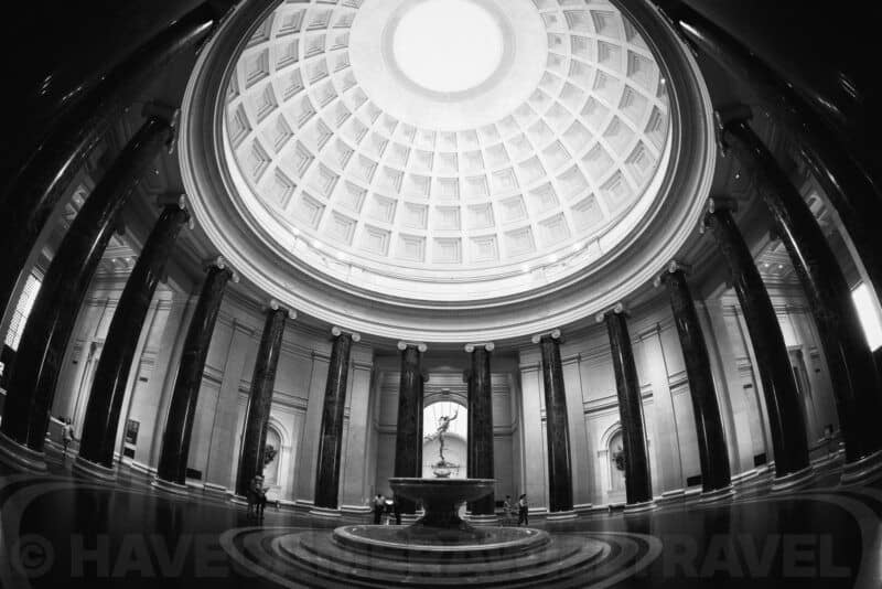 Black-and-white view of the columned fountain rotunda inside the National Gallery of Art