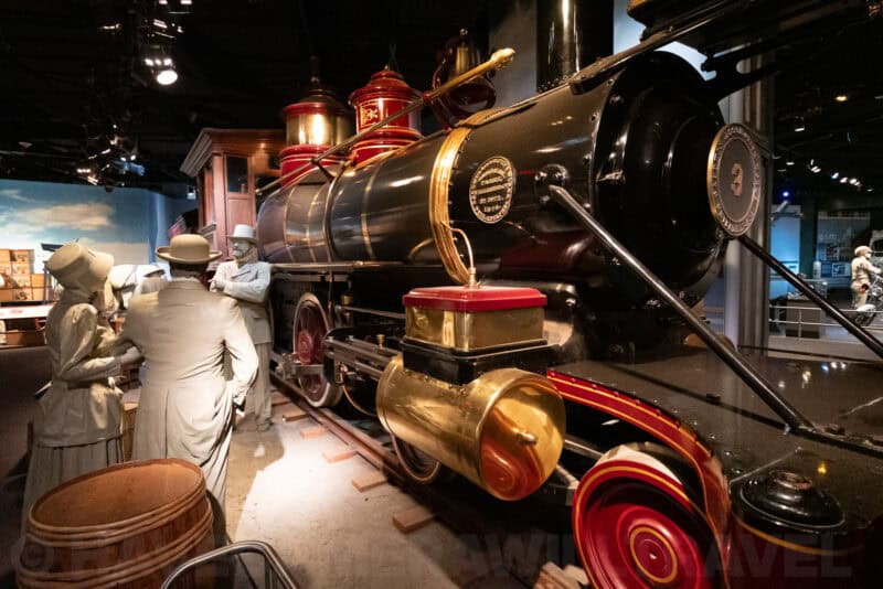 Vintage steam locomotive museum display with mannequins, shot at ISO 12800 showing low-light detail on the X-T5