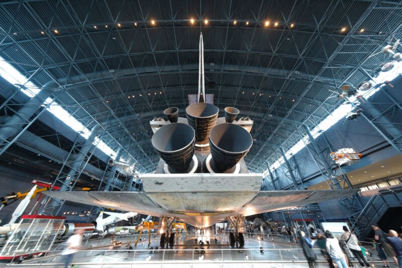 Space shuttle's tail engines and vertical stabilizer viewed from below in a museum hangar, ISO 80 test shot