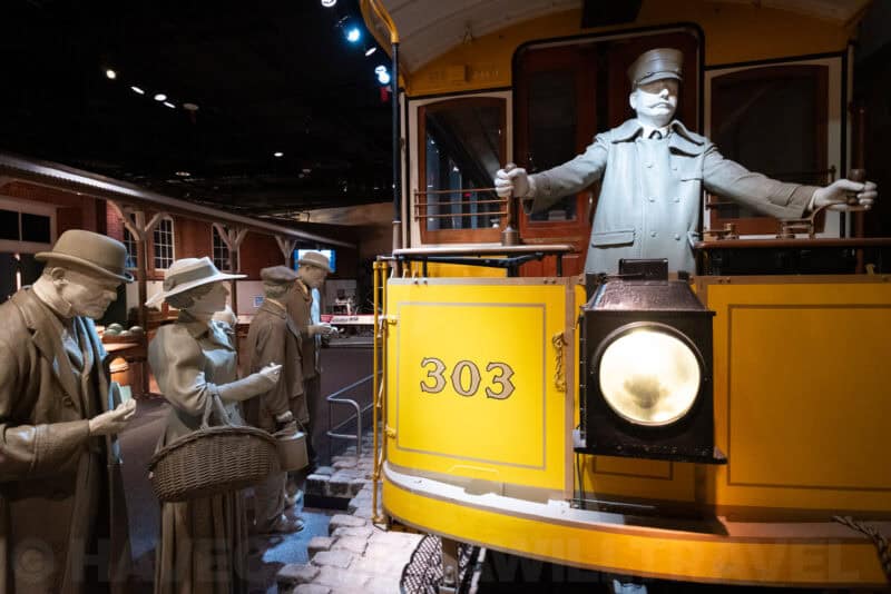 Yellow vintage streetcar numbered 303 with conductor mannequin, ISO 6400 low-light sample
