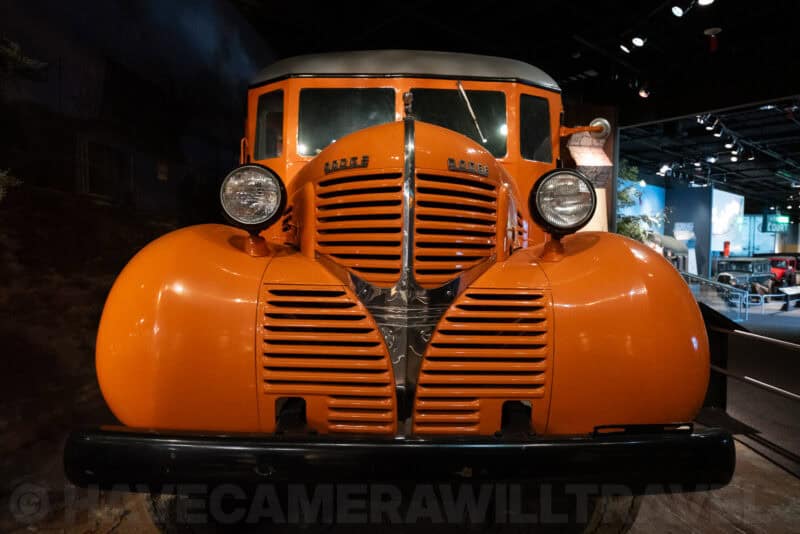 Classic orange truck front end under museum spotlights, ISO 6400 noise test image