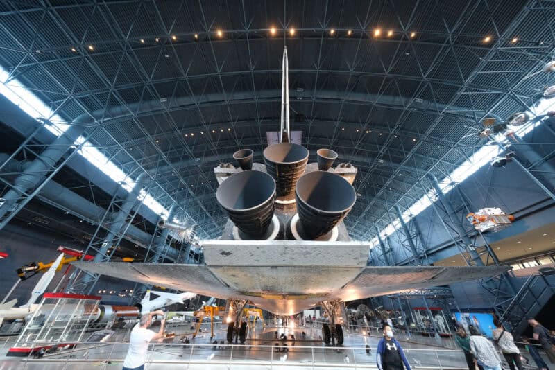 Rear view of the space shuttle's engine nozzles and tail under the hangar's steel roof, ISO 2000 test