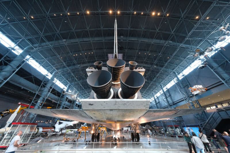 Space shuttle's three engine nozzles and tail fin under hangar lighting, ISO 4000 sample image