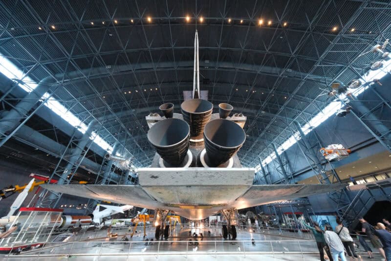 Space shuttle's engine cluster and tail fin under hangar lights, ISO 12800 test with noticeable noise