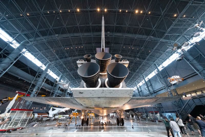 Space Shuttle Discovery's tail and engine nozzles viewed from below inside the Udvar-Hazy Center hangar