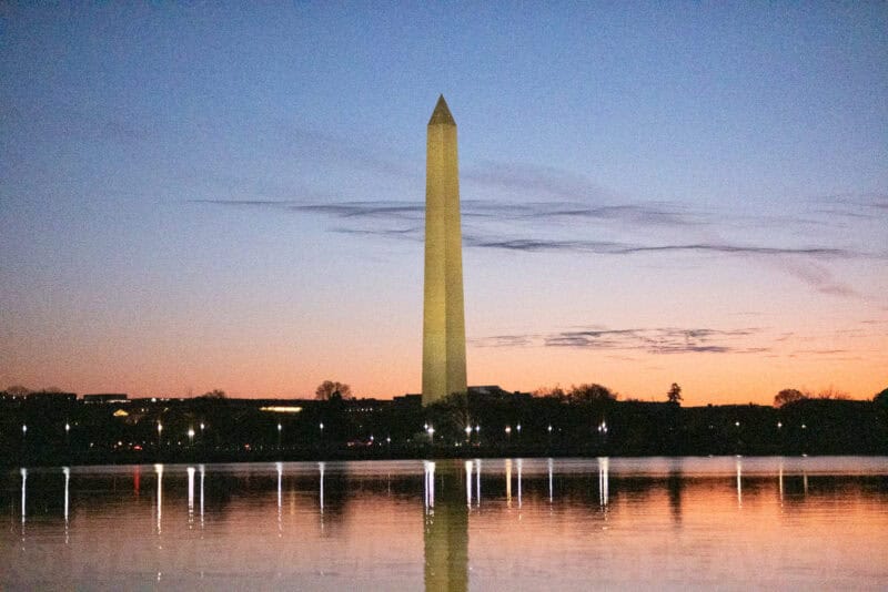 Washington Monument in dim evening light showing noticeable noise across the sky and water
