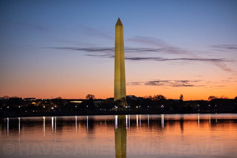 Washington Monument reflected in the Tidal Basin at sunset with orange sky