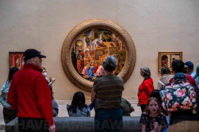 Museum visitors viewing a round Renaissance painting in an ornate gold frame at the National Gallery