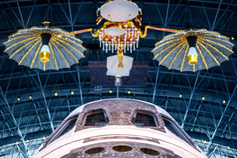 Close-up of a space shuttle nose and solar panels inside the Udvar-Hazy Air and Space Museum