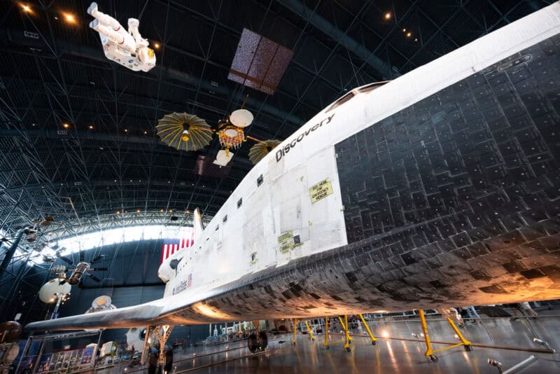 Space Shuttle Discovery's fuselage and tail viewed from below inside the Udvar-Hazy Center display hall