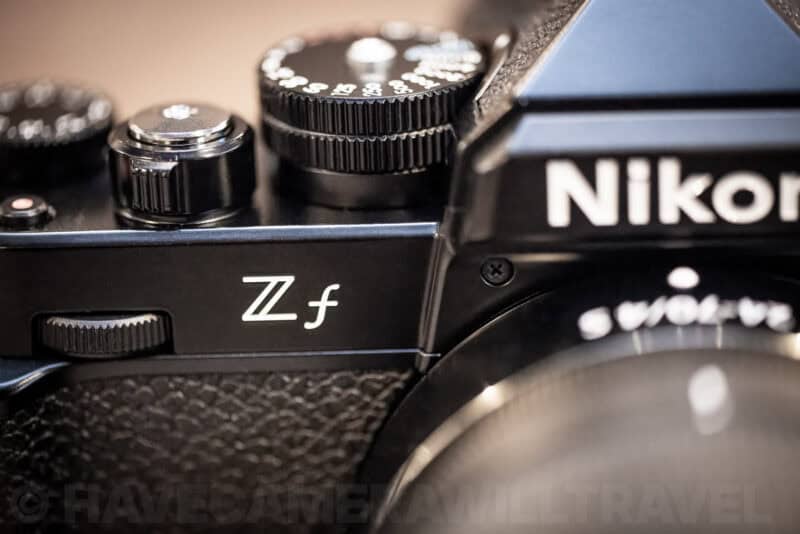 Close-up of the Nikon Zf top plate showing the Zf badge and retro dials