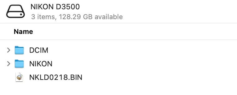 Finder window of the NIKON D3500 SD card listing DCIM and NIKON folders plus the NKLD0218.BIN firmware file