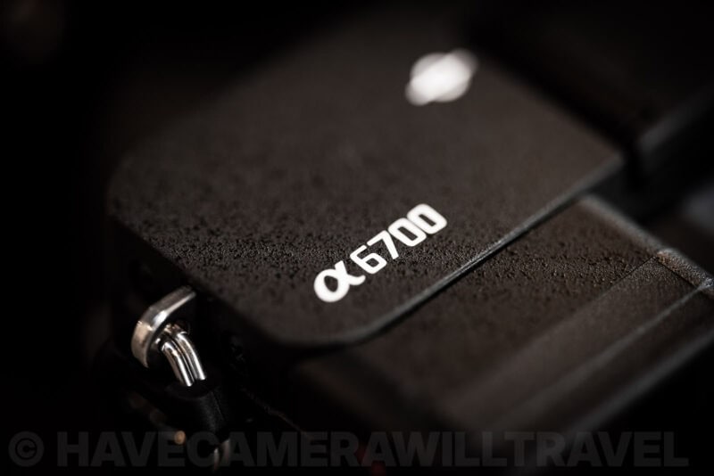 Close-up of the a6700 logo badge on the Sony a6700 camera's textured top plate