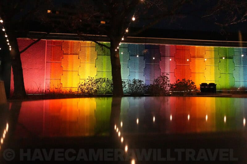Rainbow-illuminated wall with reflection showing grain at ISO 20000
