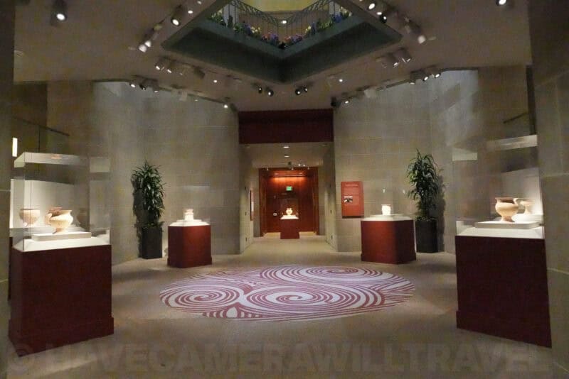 Museum gallery with vase displays showing noise at ISO 51200