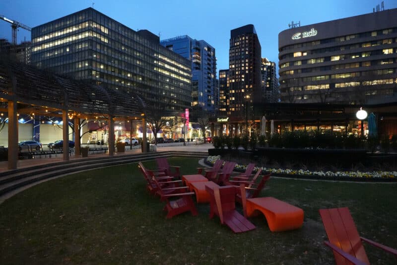 City plaza at night with red chairs and lit high-rises, ISO 10000 high-ISO test photo