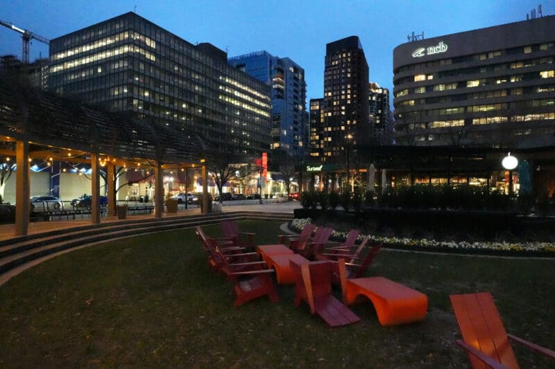 Night cityscape with red patio furniture and lit towers, ISO 32000 high-ISO sample