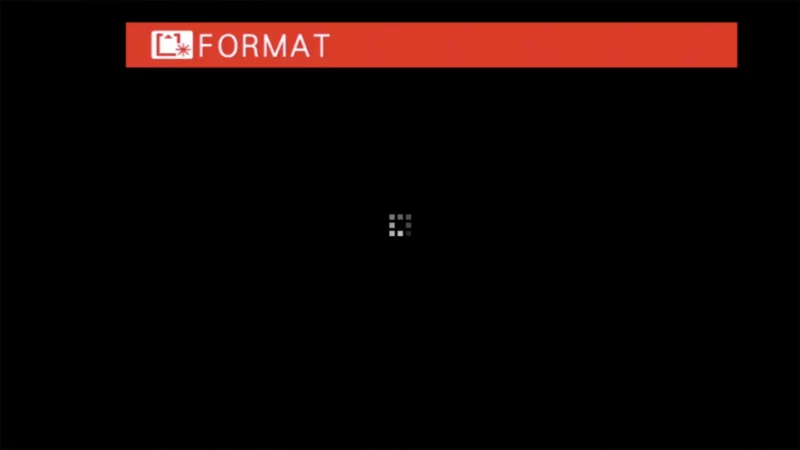 Fujifilm X100VI screen showing a red Format bar and loading icon during SD card formatting