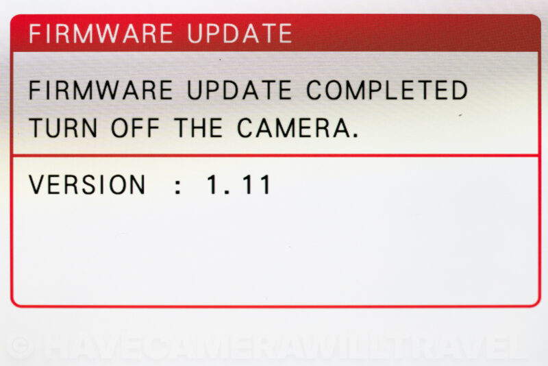 X100VI display confirming firmware update completed and showing new version 1.11