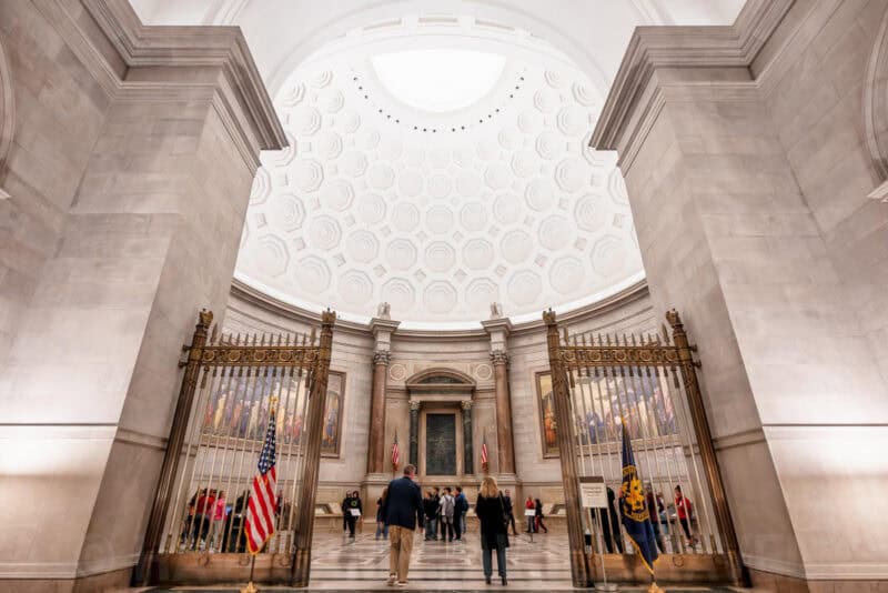 National Archives Rotunda entrance with gilded gates and domed skylight ceiling
