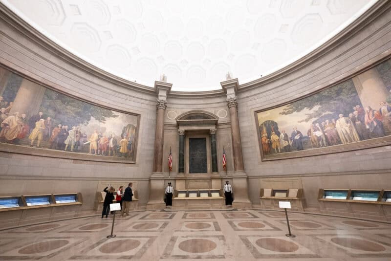 National Archives Rotunda with murals, dome ceiling and guarded display cases