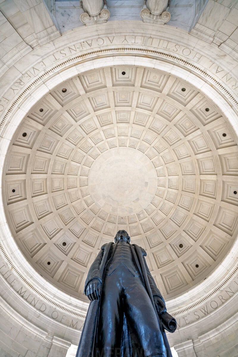 Jefferson Memorial statue viewed from below against the coffered dome interior