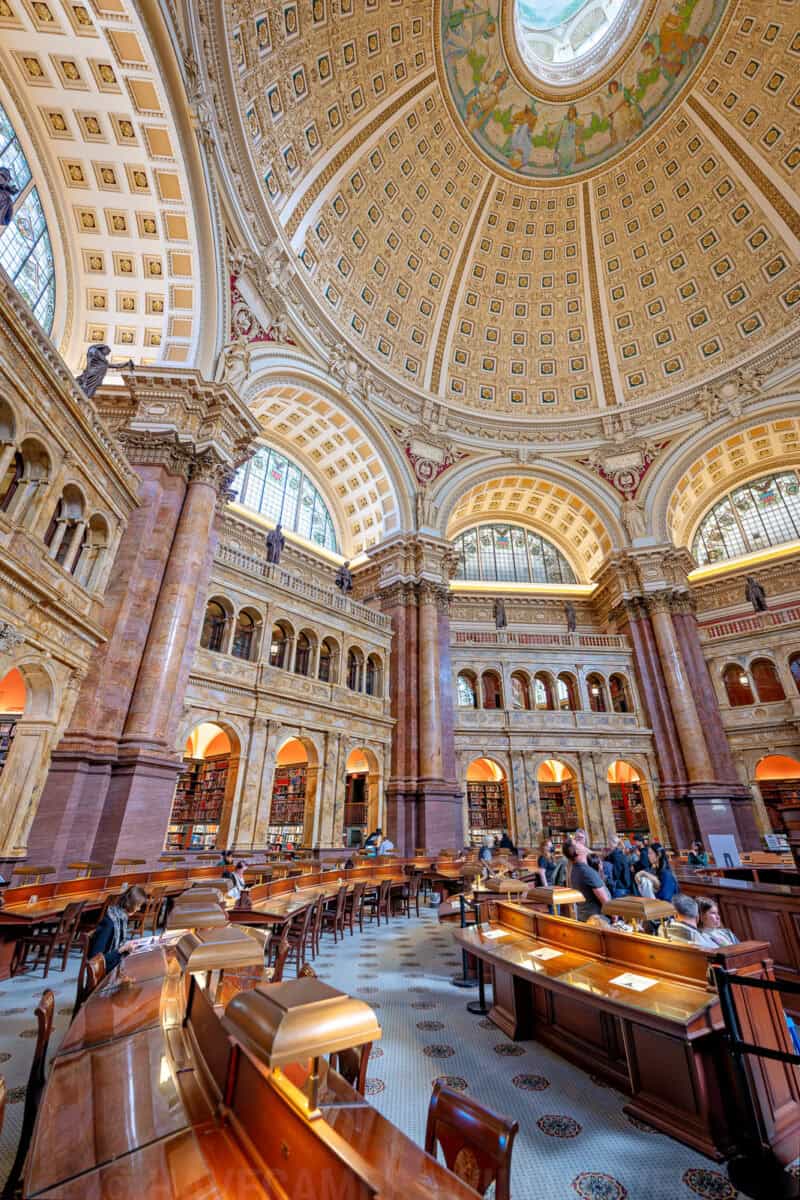 Ornate domed ceiling and reading room of the Library of Congress Main Reading Room in Washington, D.C.