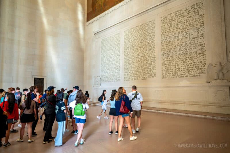 Lincoln's Second Inaugural Address Inscription with Tourists at Lincoln Memorial in Washington DC. Photo by David Coleman - havecamerawilltravel.com