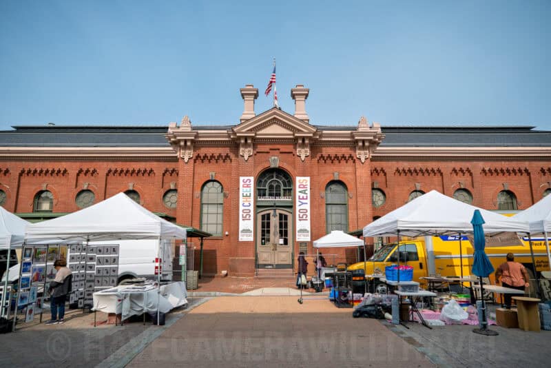 Eastern Market Building with Sunday Street Vendors Setting Up on Capitol Hill in Washington DC. Photo by David Coleman - havecamerawilltravel.com