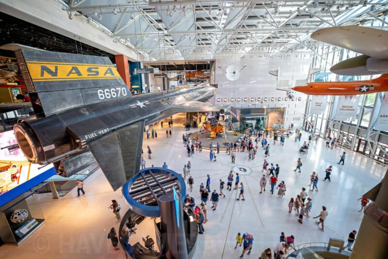 Elevated view of the National Air and Space Museum atrium with aircraft and visitors below