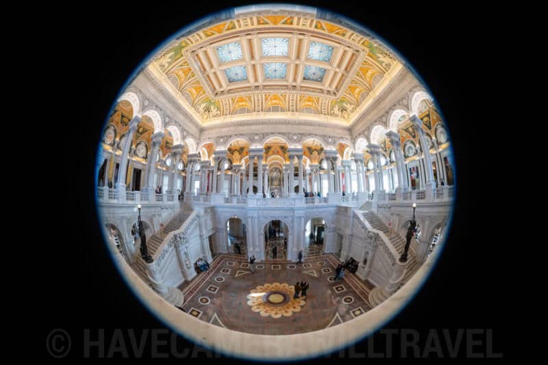 Circular fisheye frame capturing the domed ceiling and marble staircases of the Library of Congress Great Hall
