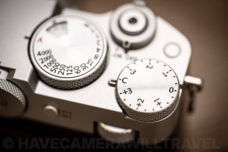 Close-up of the shutter speed and exposure compensation dials on top of the Fujifilm GFX100RF
