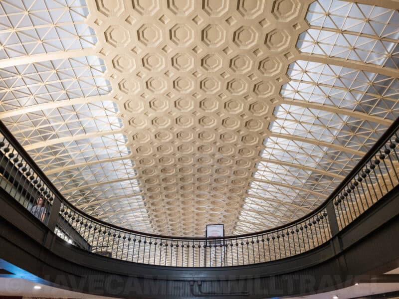 Curved balcony railing beneath Union Station's ornate vaulted glass skylight ceiling
