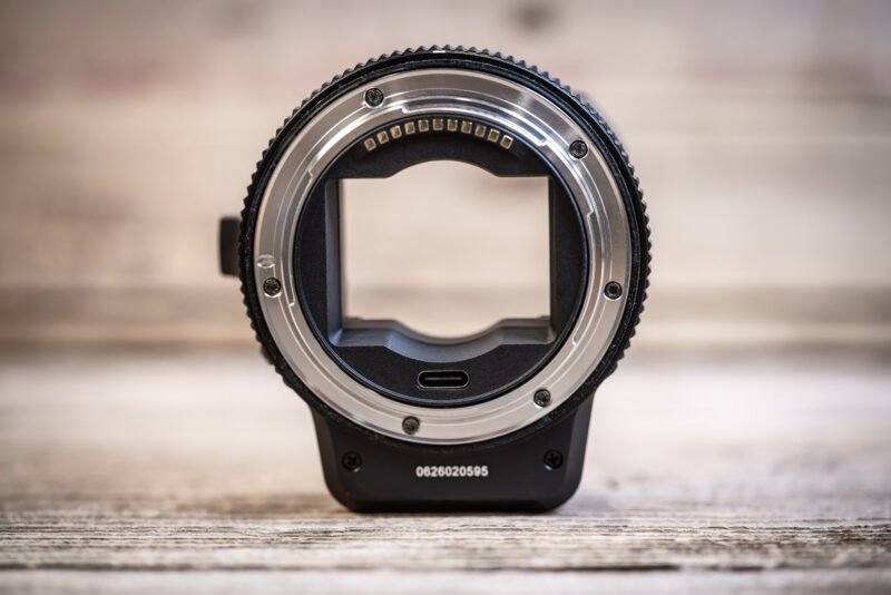 MonsterAdapter LA-FZ1 viewed head-on, showing its gold electrical contacts, silver Nikon Z mount ring and USB-C port